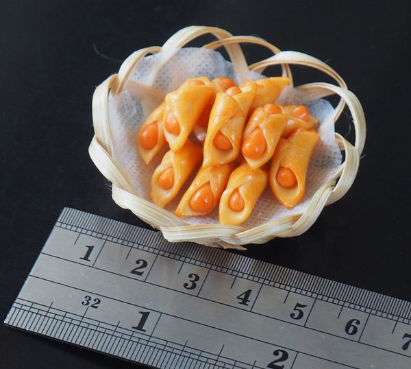 Miniature Sausage Bread Rolls on Basket