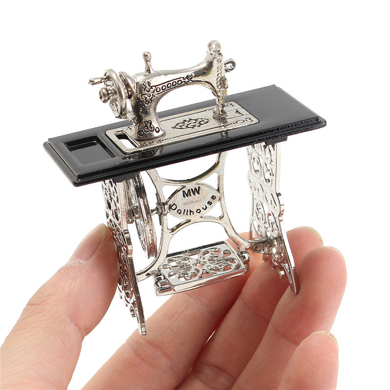 Playing with a Miniature Sewing Machine
