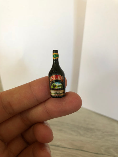 Miniature Baileys on finger
